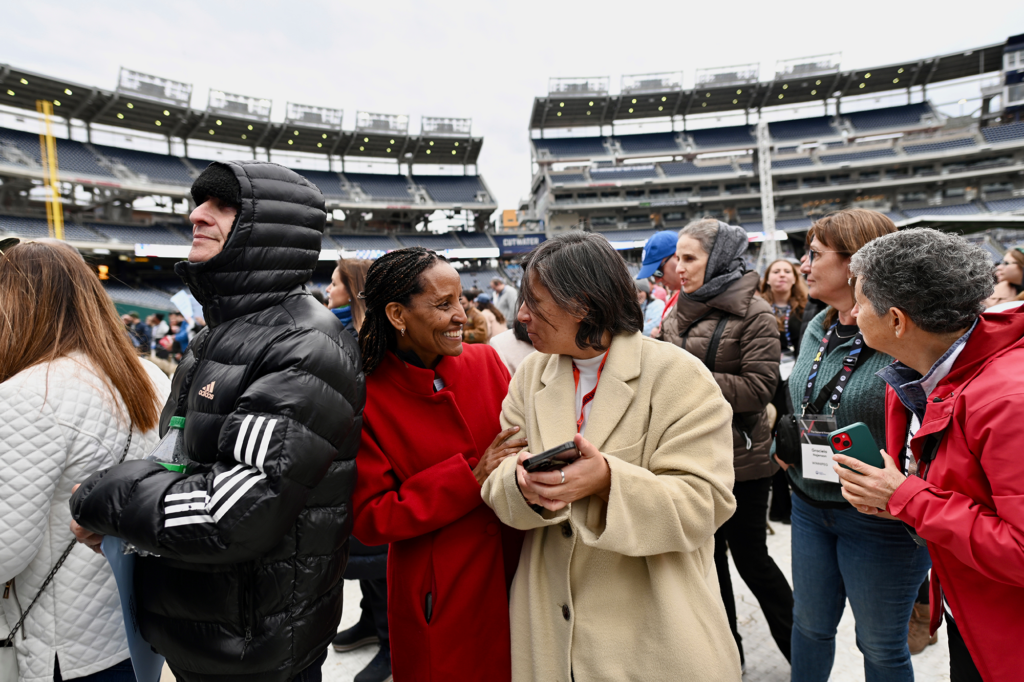 women greet each other