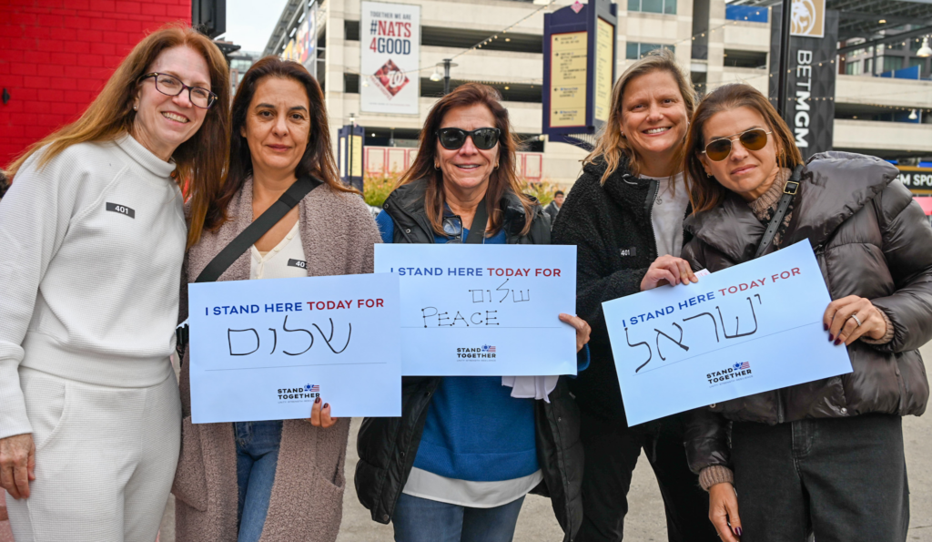 women holding signs calling for peace