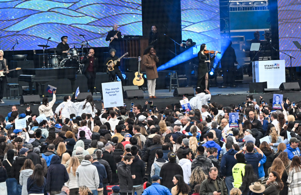 crowd gathers around band onstage